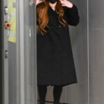 Lindsay Lohan in a Black Coat Arrives at JFK Airport in New York 02/20/2022