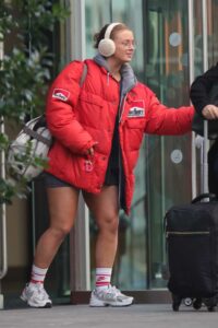 Maisie Smith in a Red Puffer Jacket