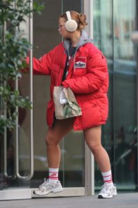 Maisie Smith in a Red Puffer Jacket