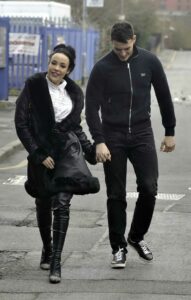 Stephanie Davis in a Black Leather Coat