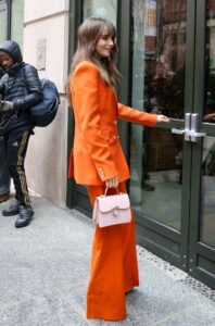 Lily Collins in an Orange Pantsuit