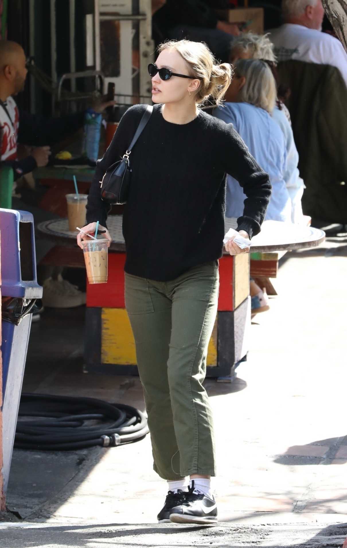 Lily-Rose Depp in a Black Sweater