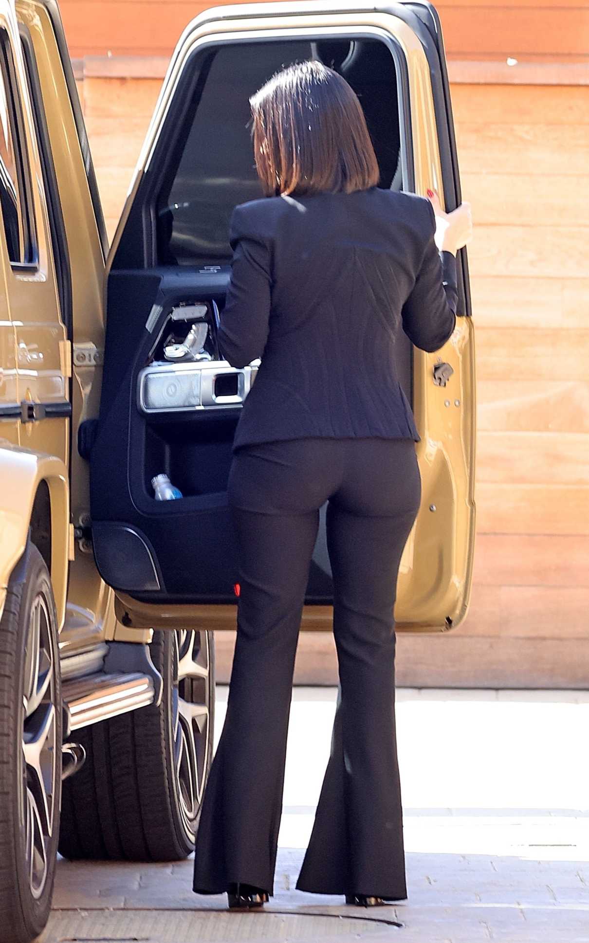 Kourtney Kardashian in a Black Pantsuit