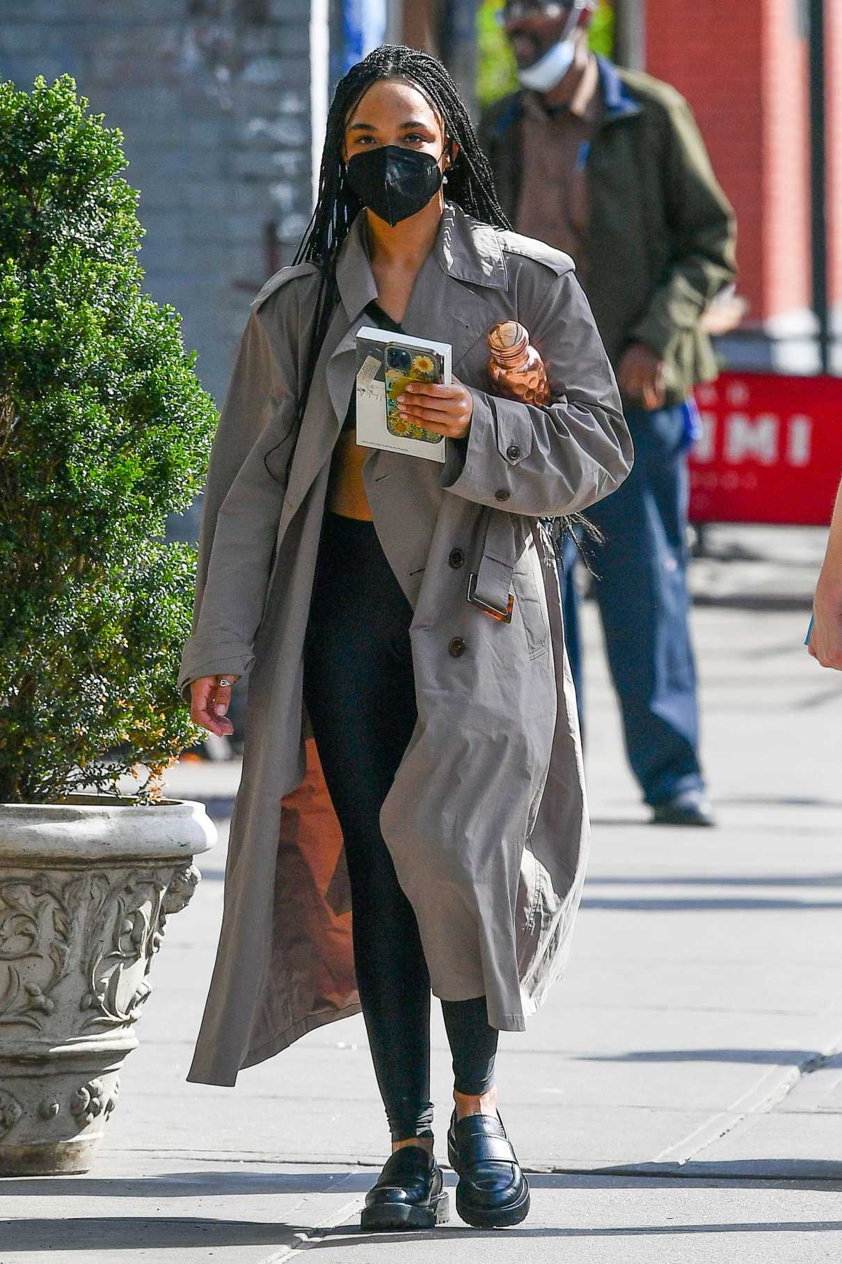 Tessa Thompson in a Grey Trench Coat