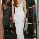 Eleanor Tomlinson in a White Dress Leaves Her Hotel in London 05/08/2022
