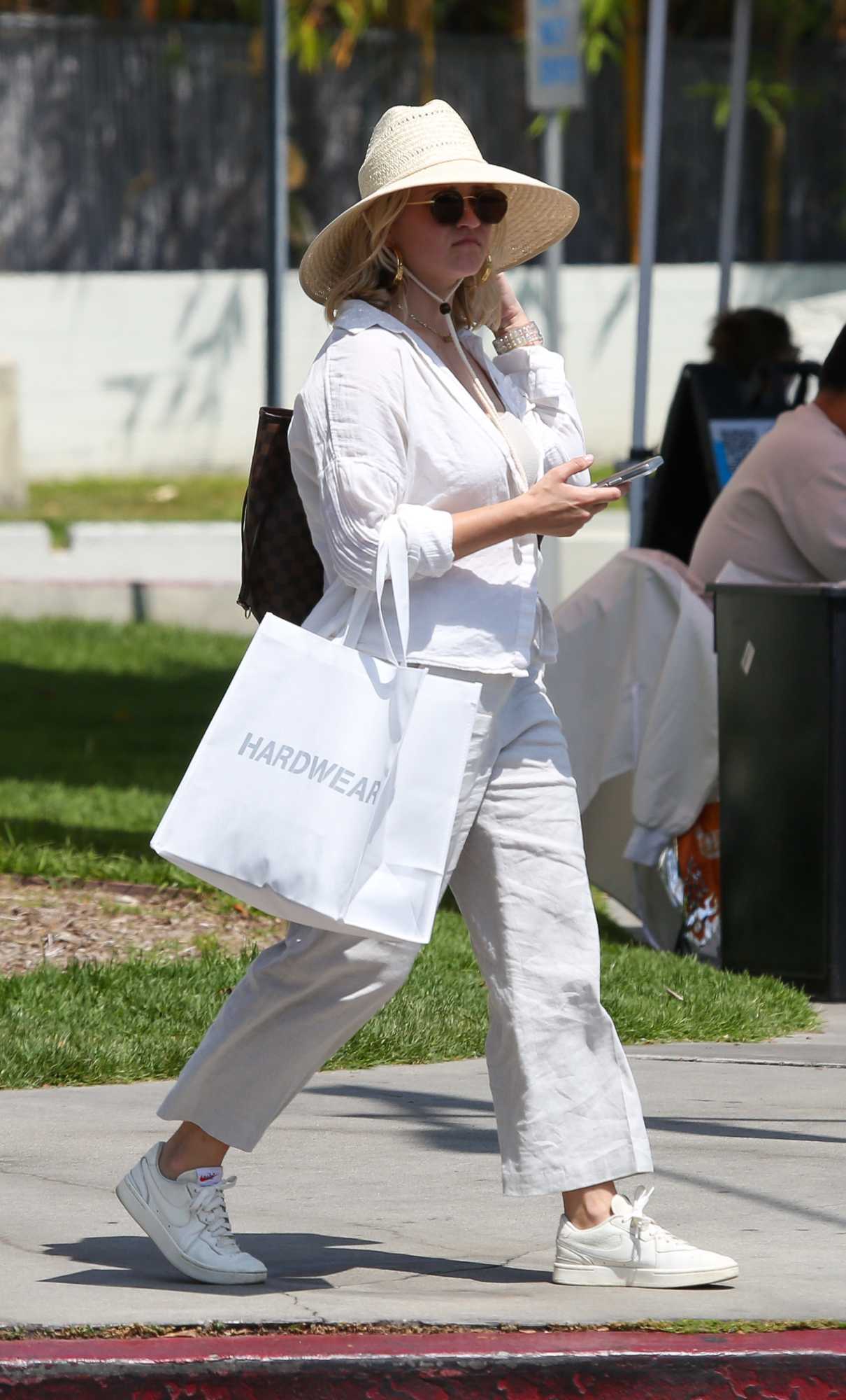 Emily Osment in a White Shirt Goes Shopping in Los Angeles 05/26/2022-2 ...