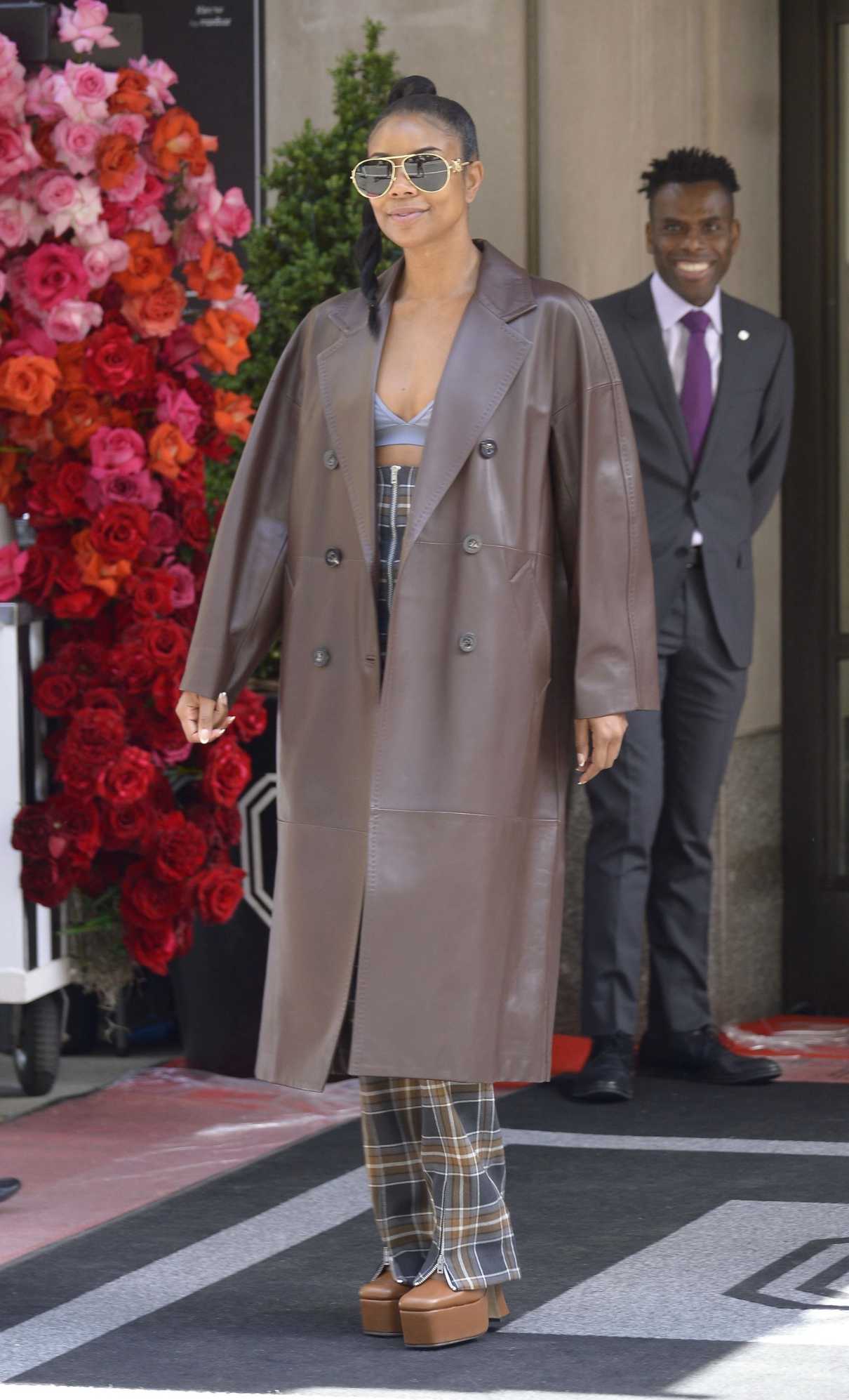 Gabrielle Union in a Brown Leather Trench Coat