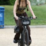 Olivia Rodrigo in a Green Hat Riding a Bike Around Washington 05/04/2022
