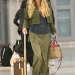 Kesha in a Black Cap Arrives at JFK Airport in New York City 06/20/2022