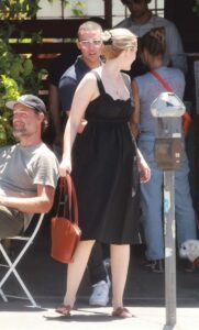Olivia Macklin in a Black Dress