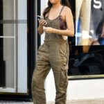 Ashley Park in a White Sneakers Goes Shopping in Paris 07/18/2022