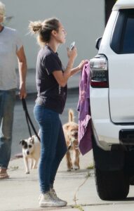 Dylan Penn in a White Converse Gym Shoes