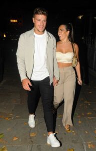 Gemma Owen in a Beige Top
