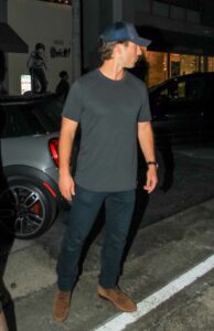 Glen Powell in a Grey Tee