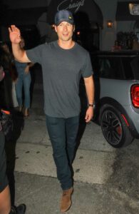 Glen Powell in a Grey Tee