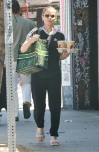 Kate Mara in a Black Adidas Tee