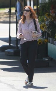 Marcia Cross in a Lilac Floral Blouse