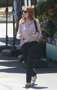 Marcia Cross in a Lilac Floral Blouse