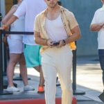 Nick Jonas in a White Sneakers Arrives at the Maxfield Clothing Store in West Hollywood 08/17/2022