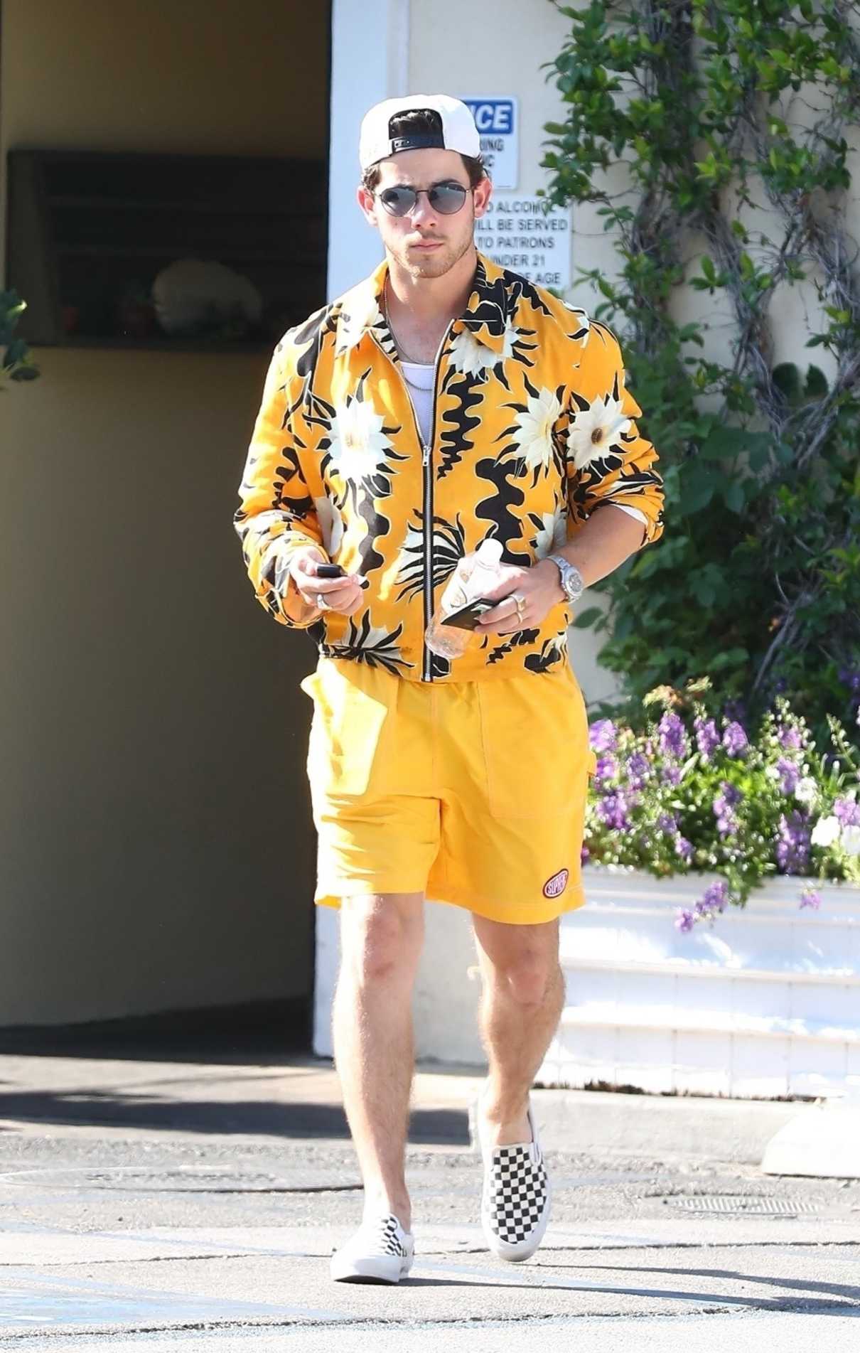 Nick Jonas in a Yellow Shorts