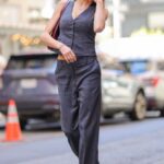 Charlotte McKinney in a Striped Grey Pantsuit Was Seen Out in New York 09/15/2022