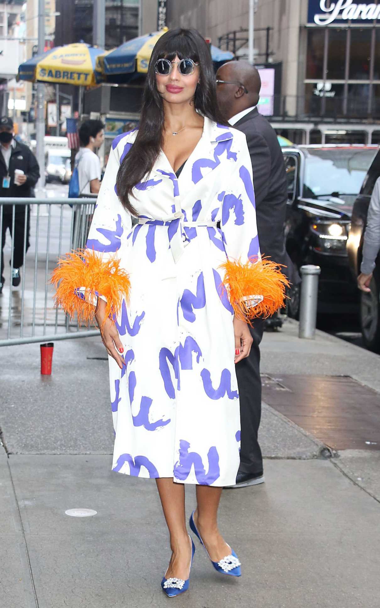 Jameela Jamil in a White Trench Coat