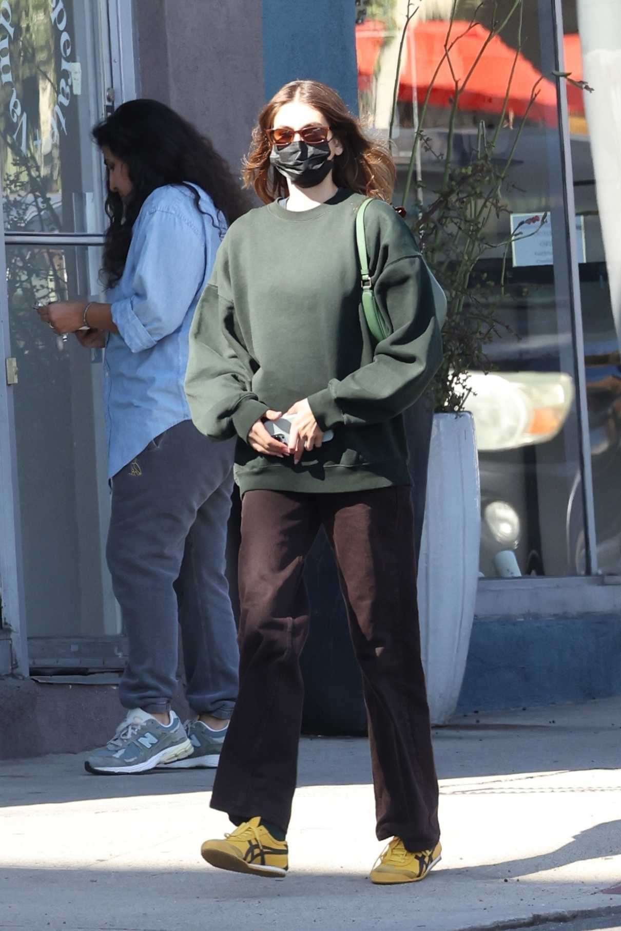 Kaia Gerber in a Yellow Sneakers