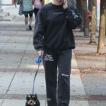 Lili Reinhart in a Black Sweatsuit Walks Her Dog Milo in Vancouver 10/16/2022