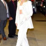 Emily Blunt in a White Pantsuit Arrives at The Colbert Show in New York City 11/10/2022