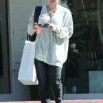 Hilary Duff in a White Cardigan Shops at a Clothing Store in Los Angeles 11/03/2022