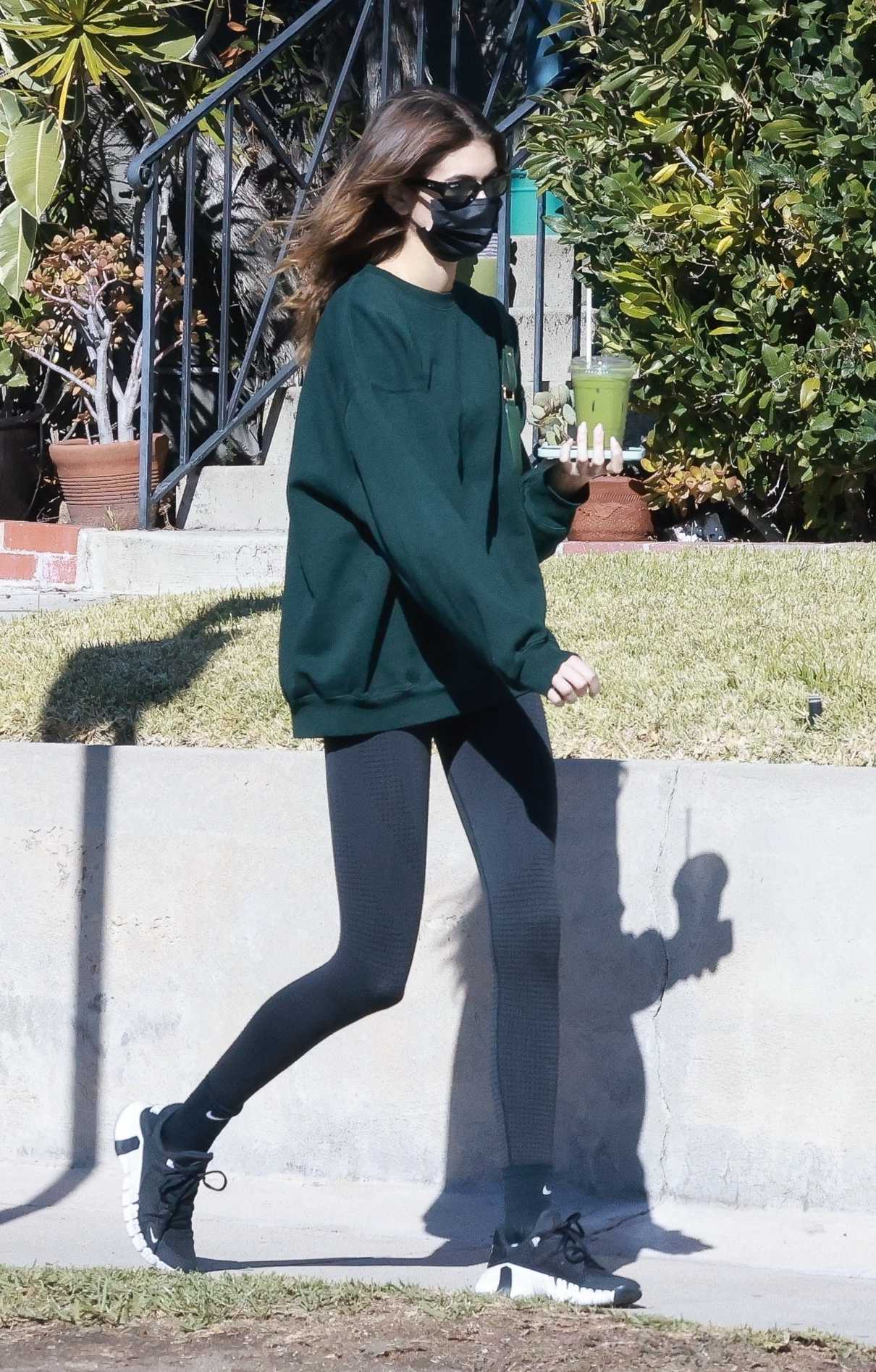 Kaia Gerber in a Green Sweatshirt