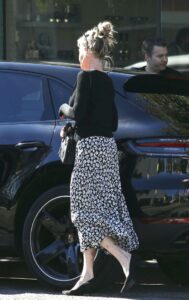 Melanie Griffith in a Black Floral Skirt