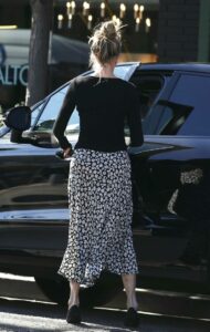 Melanie Griffith in a Black Floral Skirt