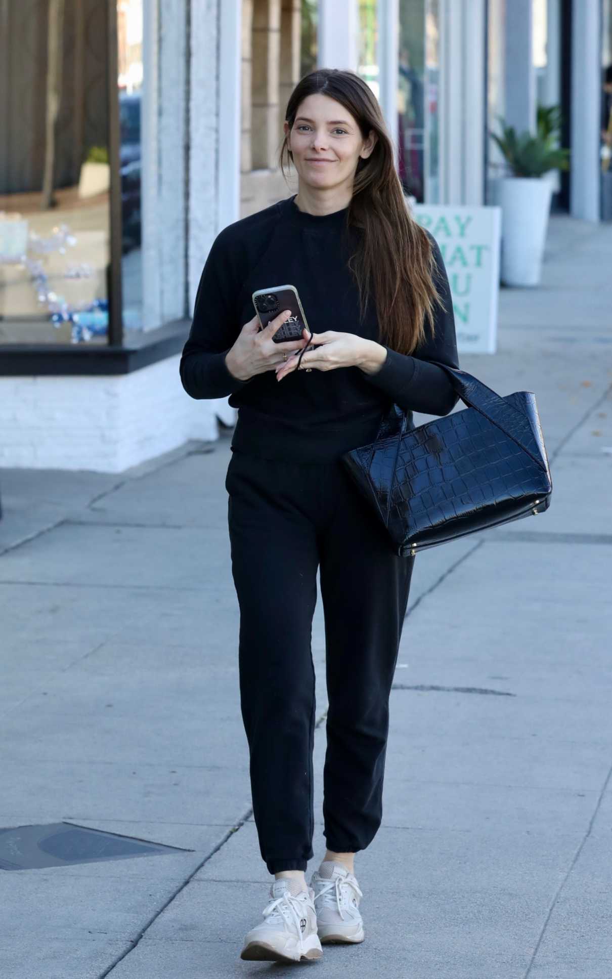 Ashley Greene in a Black Sweatsuit