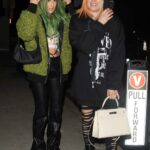 Avril Lavigne in a Black Oversized Hoodie Steps Out to Dinner with a Friend at Giorgio Baldi in Santa Monica 12/17/2022