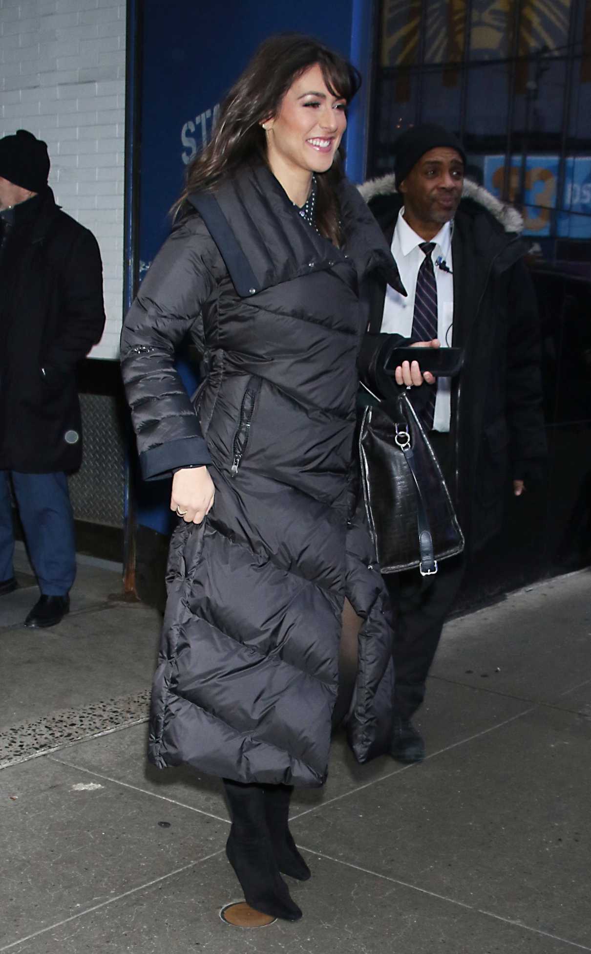 Erielle Reshef in a Black Puffer Coat