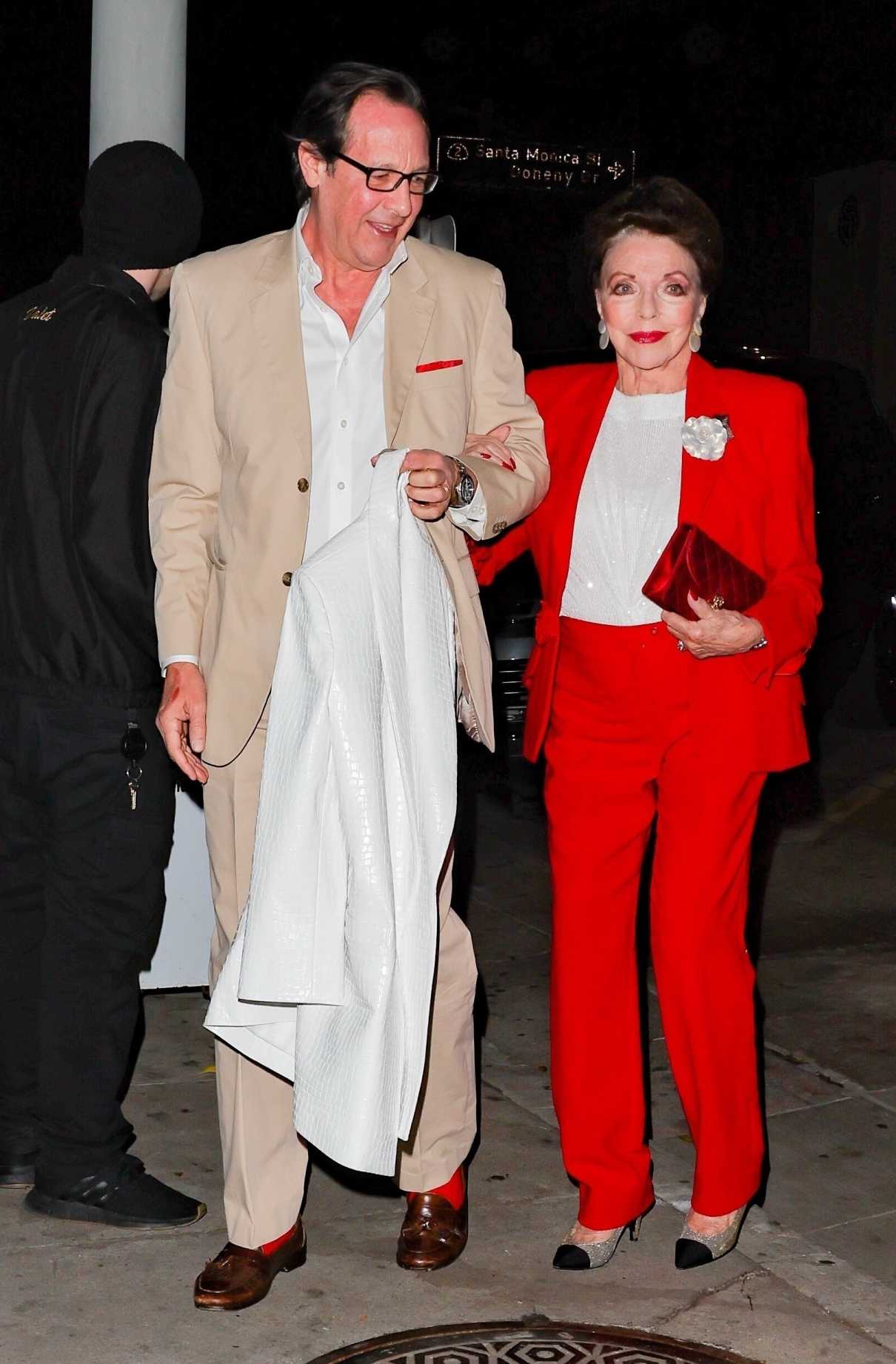 Joan Collins in a Red Pantsuit