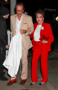 Joan Collins in a Red Pantsuit