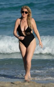 Josie Goldberg in a Black Swimsuit