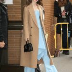 Lily Collins in a Caramel Coloured Coat Arrives for a Taping of The View in New York City 12/12/2022