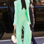 Lily Collins in a Neon Green Pantsuit Heads Out for an Appearance on The Drew Barrymore Show in New York 12/14/2022