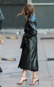 Margot Robbie in a Black Leather Trench Coat