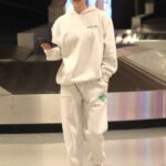 Nina Agdal in a White Sweatsuit Arrives in Los Angeles 12/08/2022