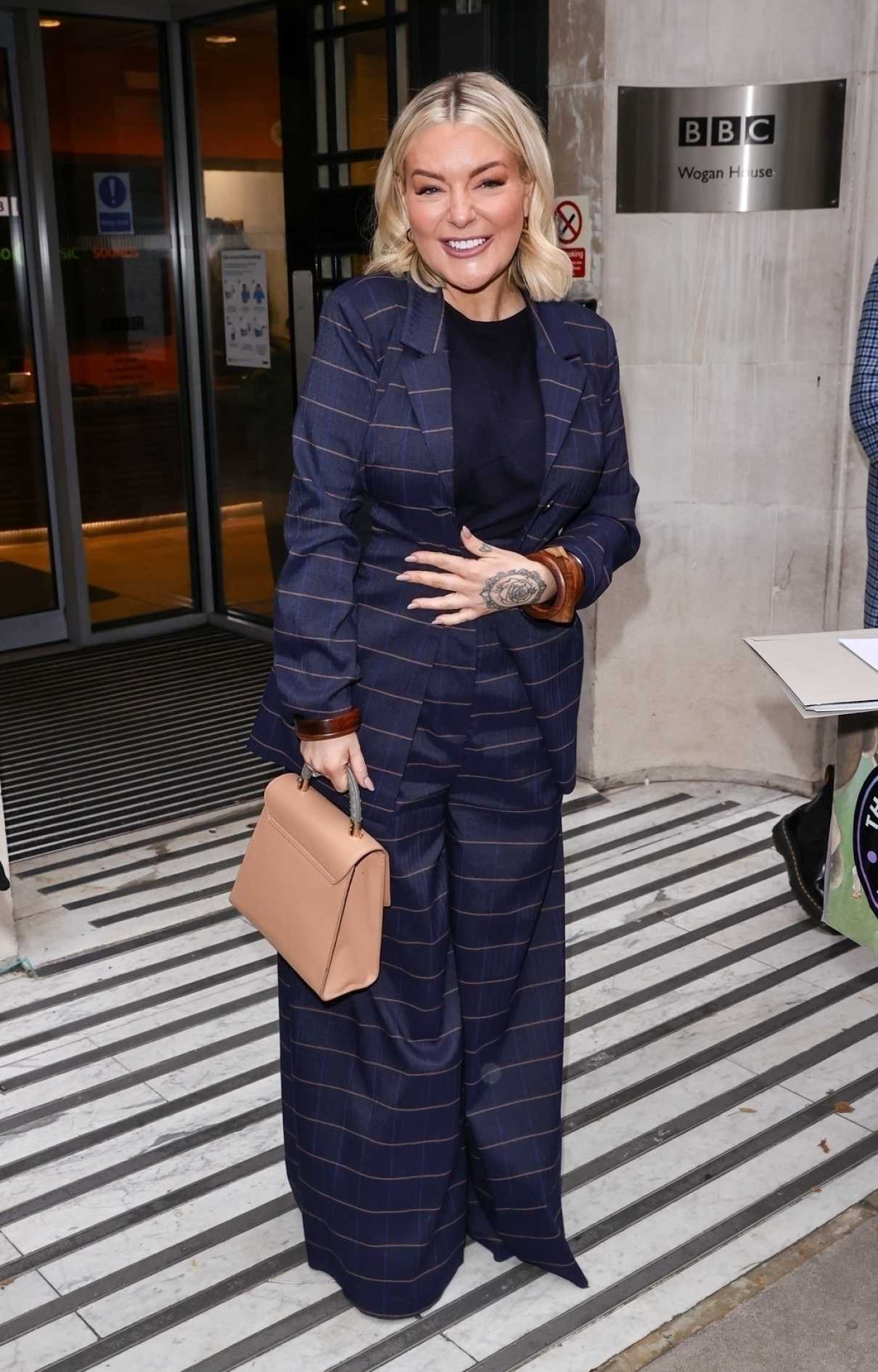 Sheridan Smith in a Blue Striped Pantsuit