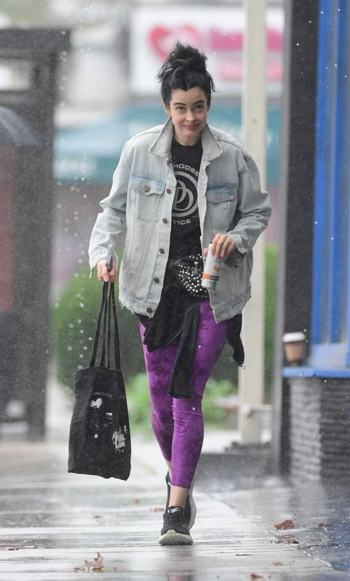 Krysten Ritter in a Purple Leggings