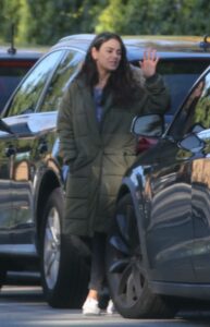 Mila Kunis in an Olive Puffer Coat