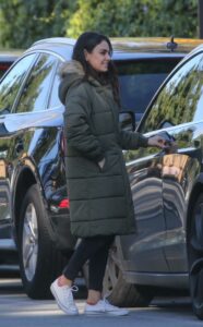 Mila Kunis in an Olive Puffer Coat