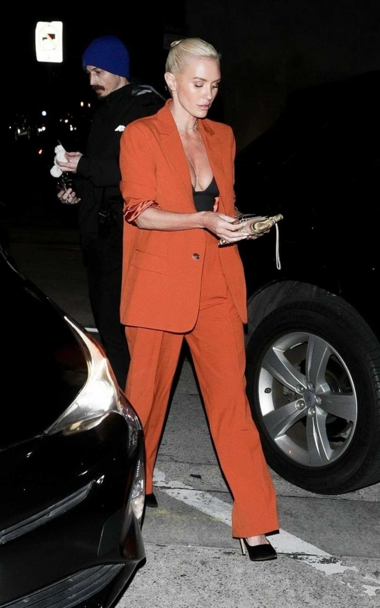 Nicky Whelan in an Orange Pantsuit