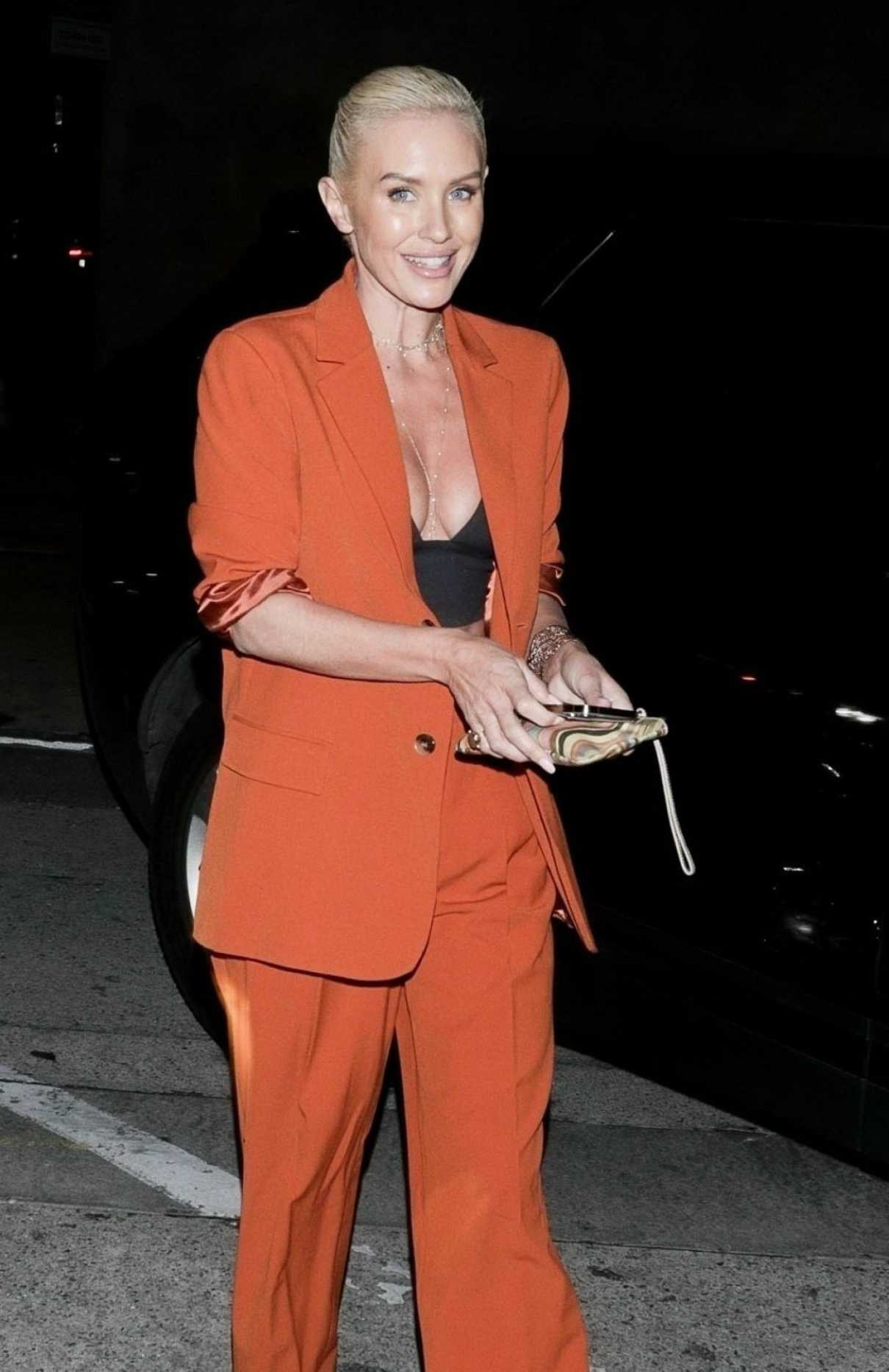 Nicky Whelan in an Orange Pantsuit