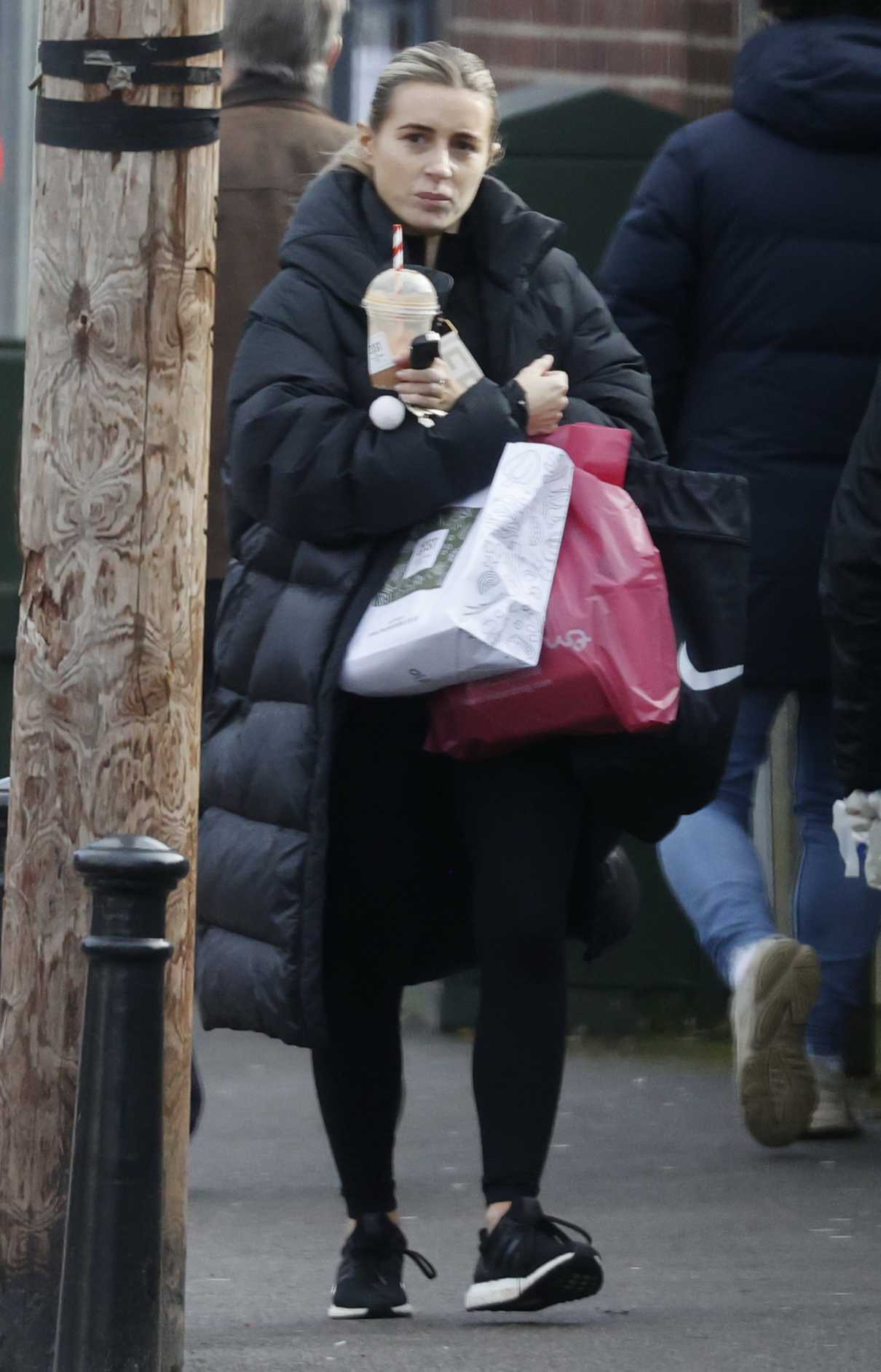 Dani Dyer in a Black Puffer Coat